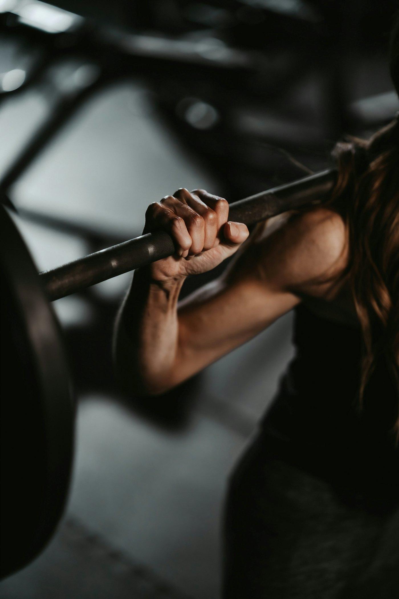 Athlete gripping a barbell